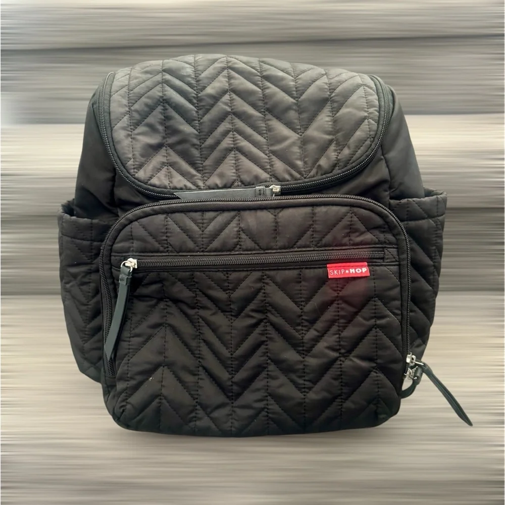 Skip Hop Forma Diaper Backpack. Black Exterior with Teal Interior.